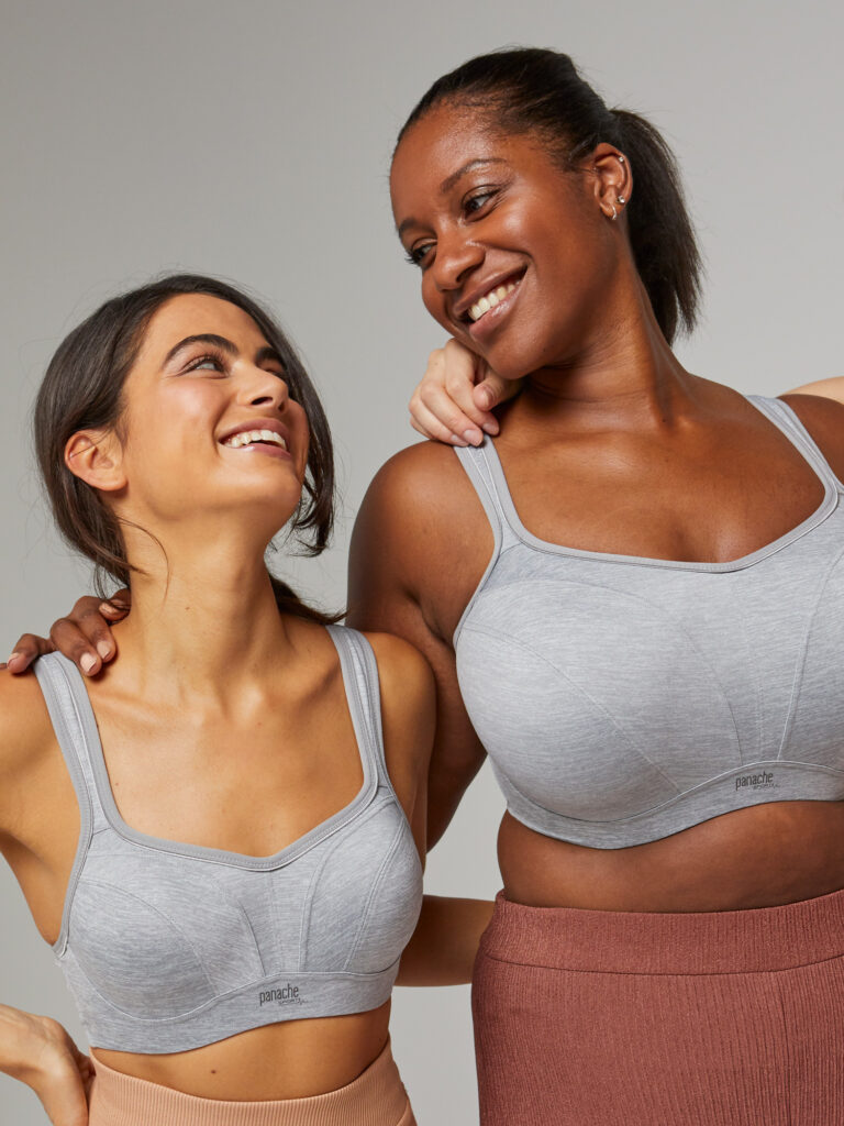 Image of two women wearing the Panache sports bra in gray marl