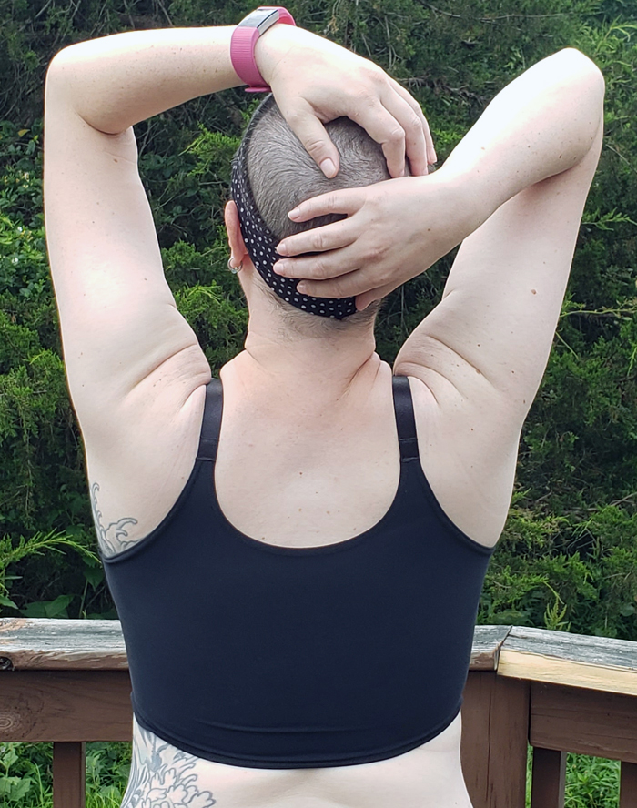 back view of the comfeez on the body with arms raised