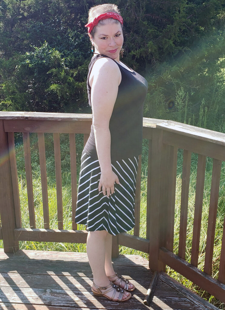 Side profile view of Exclusively Kristen tank top untucked