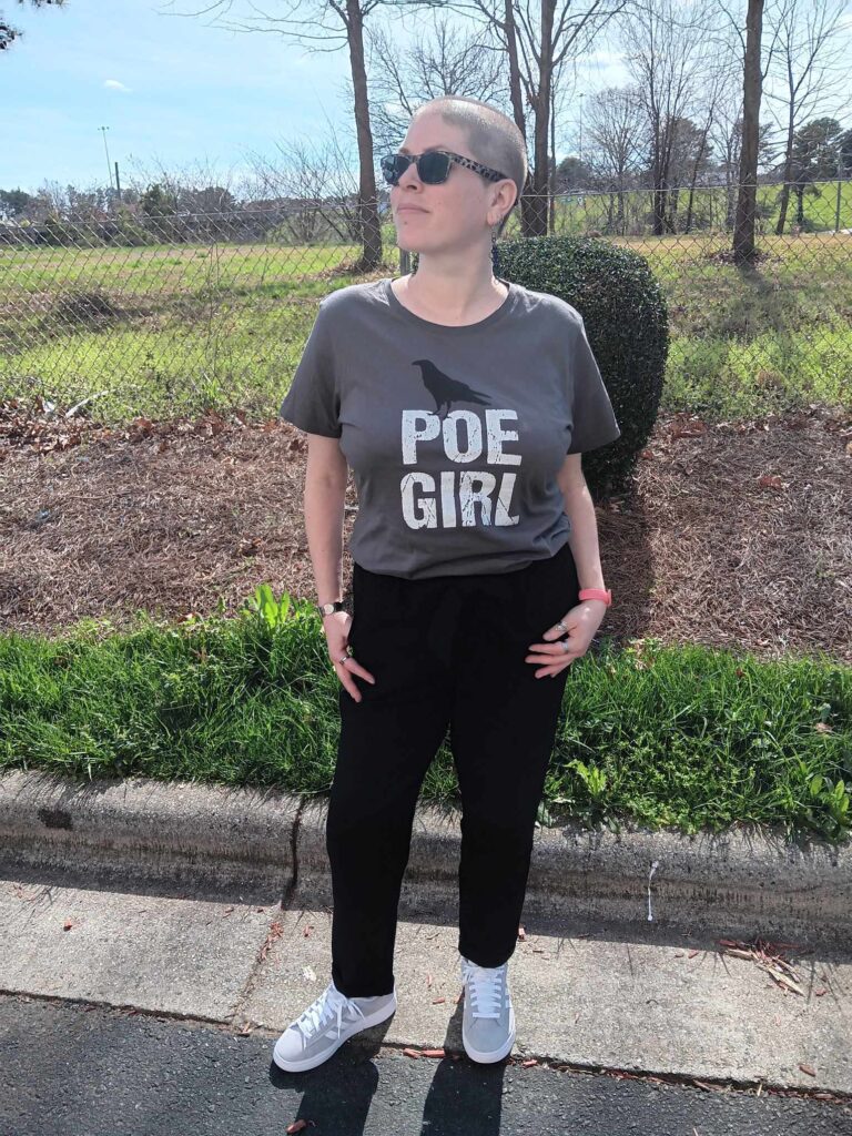 No update would be complete without an image of me wearing a cute outfit, black pants, a Poe girl top, and sneakers